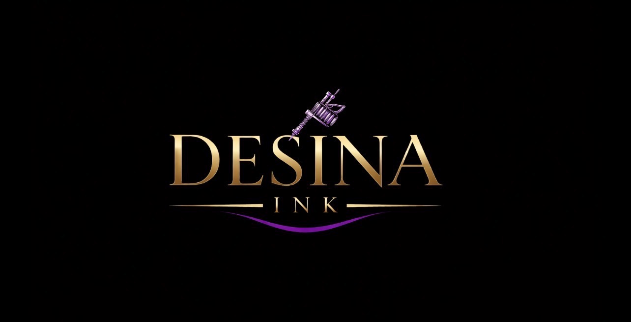 Desína Ink Tattoos gold and violet logo mark with a tattoo machine, glowing on a black studio backdrop